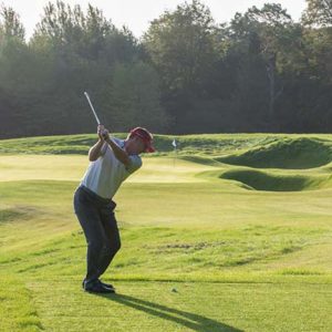 Pro golfer testing at 17th hole on new course